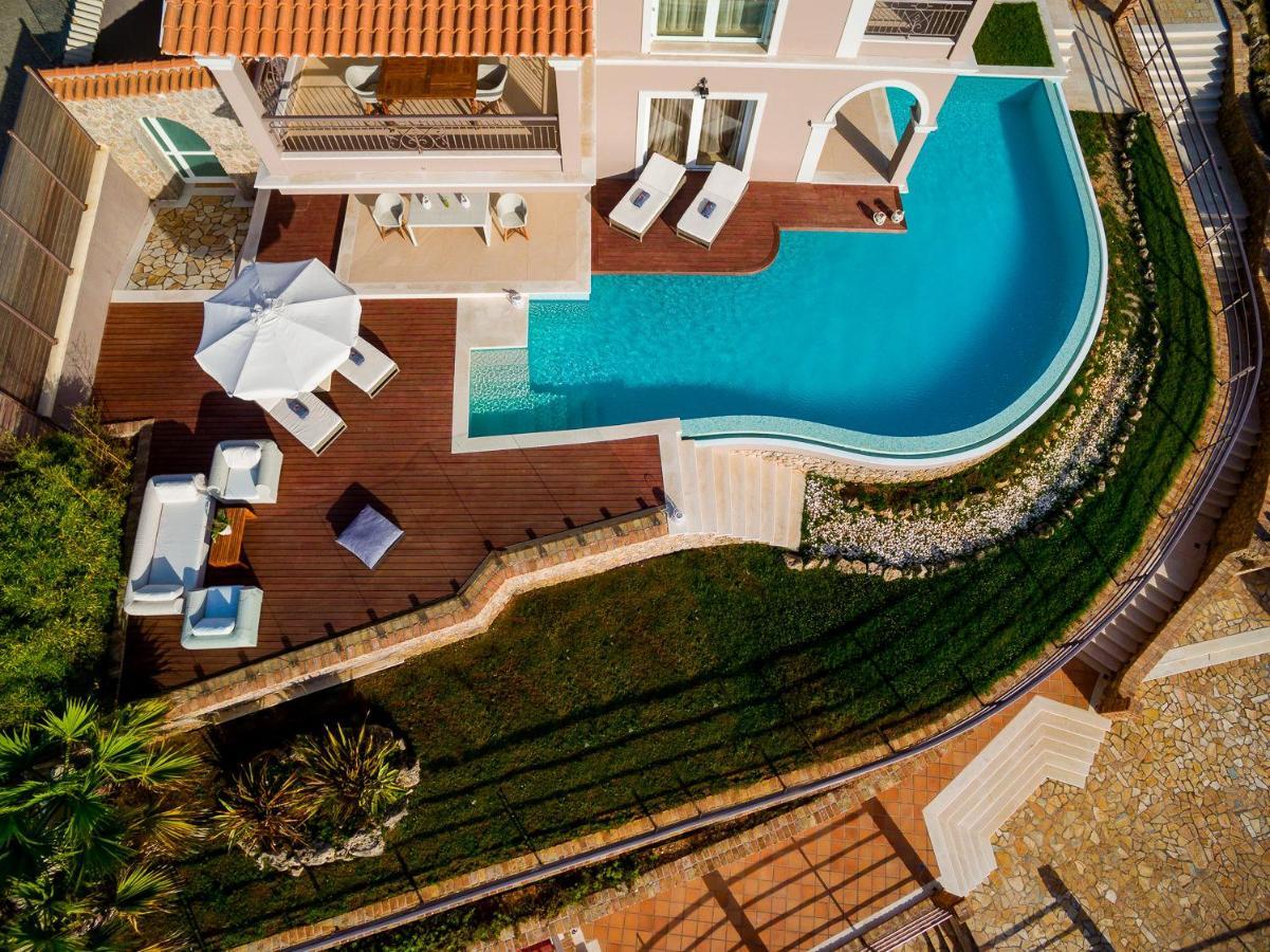 Pictures Suites Агиос Стефанос Экстерьер фото